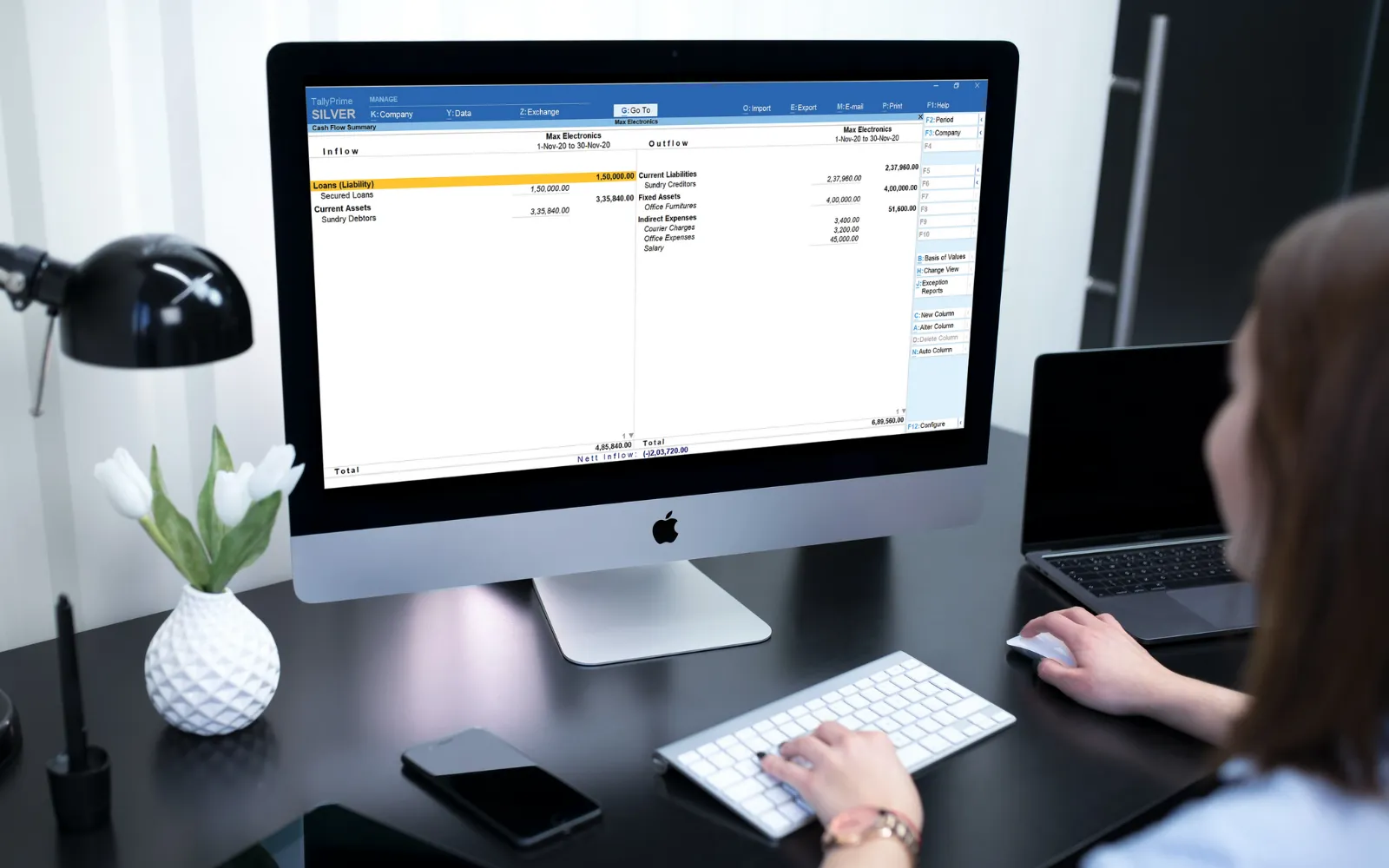 a women using computer system for using tally prime software 